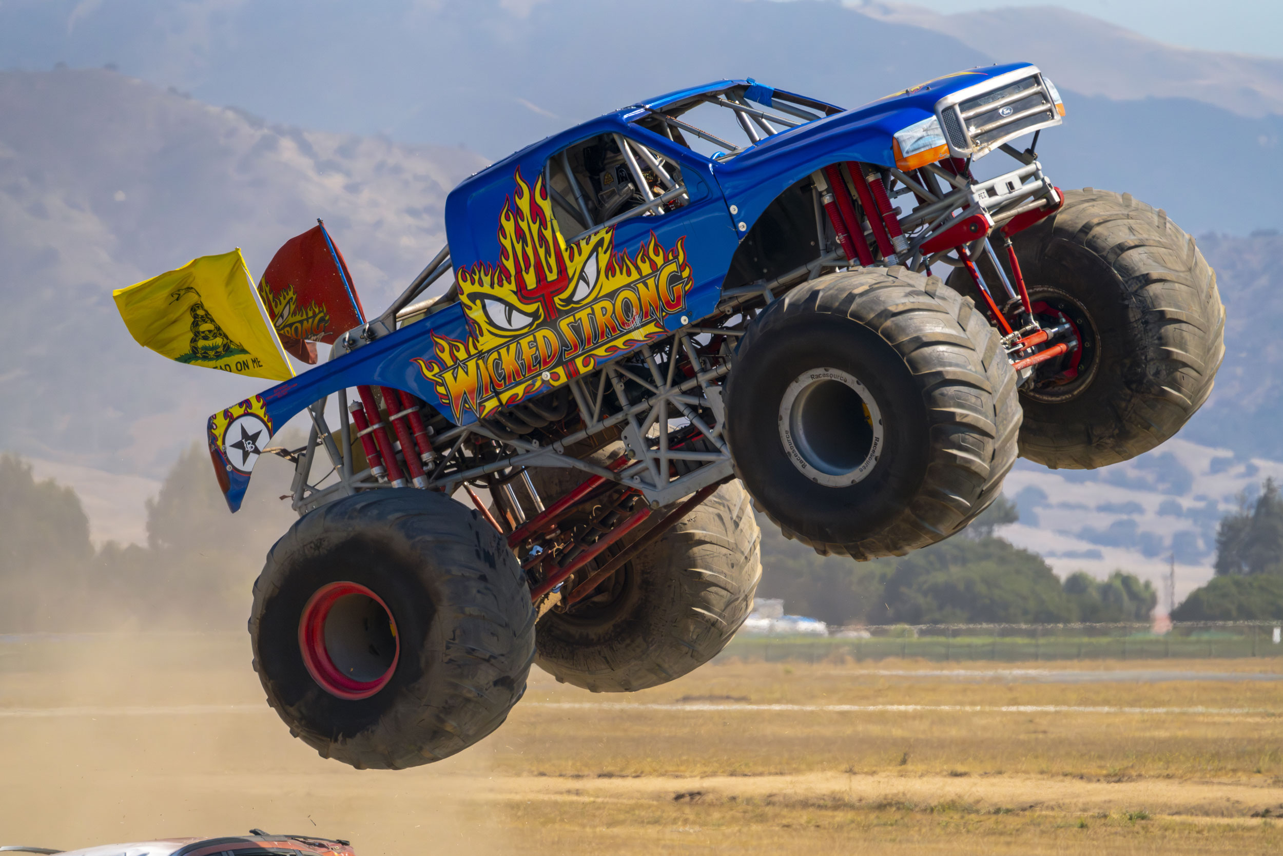 Monster Truck: Wicked Strong jumped over a carJ